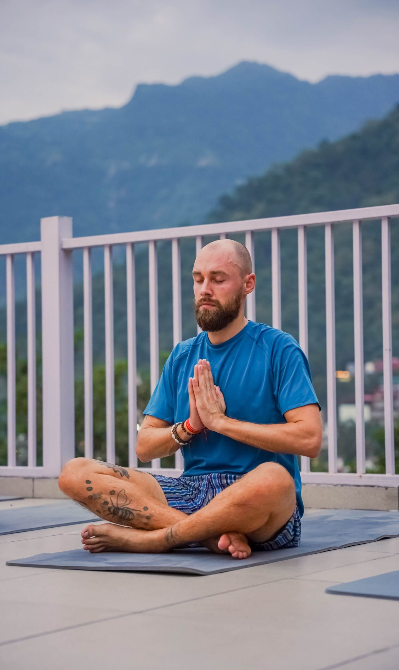 Group Yoga classes Bajamar La Laguna Tenerife with green trees in the background.