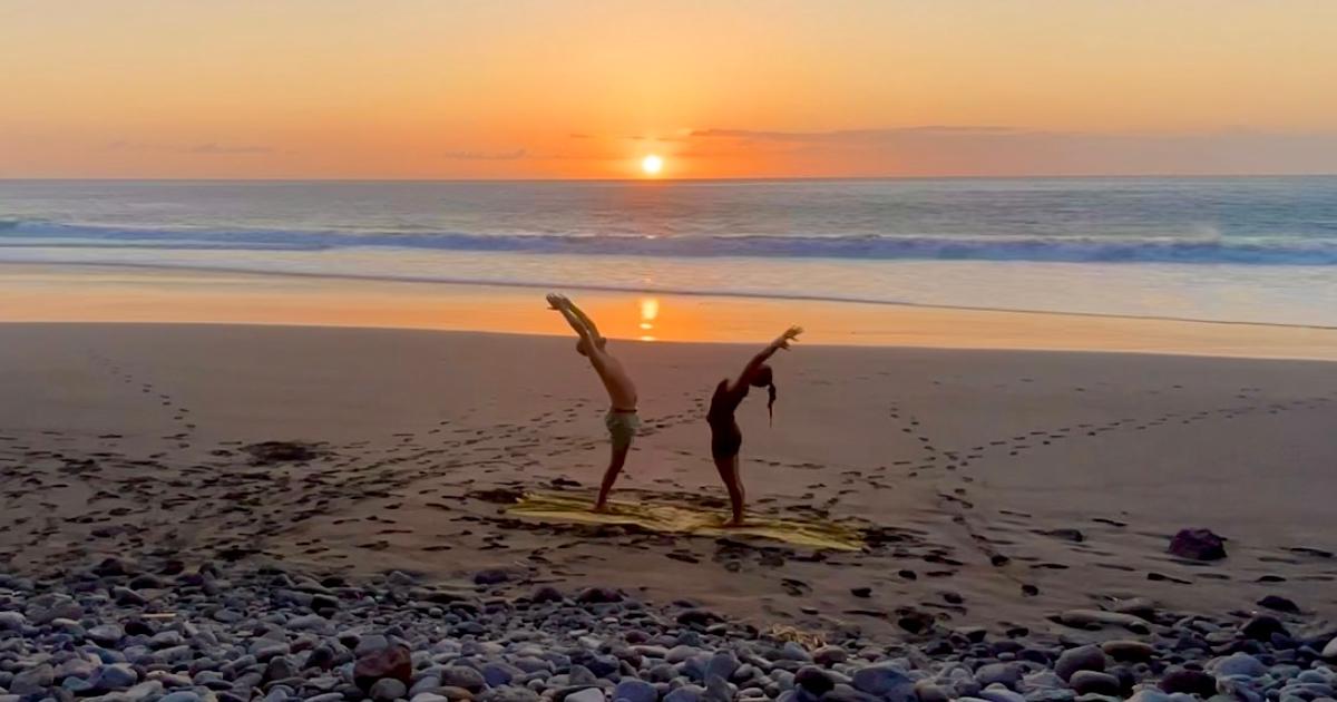 Group Yoga classes Bajamar La Laguna Tenerife with green trees in the background.